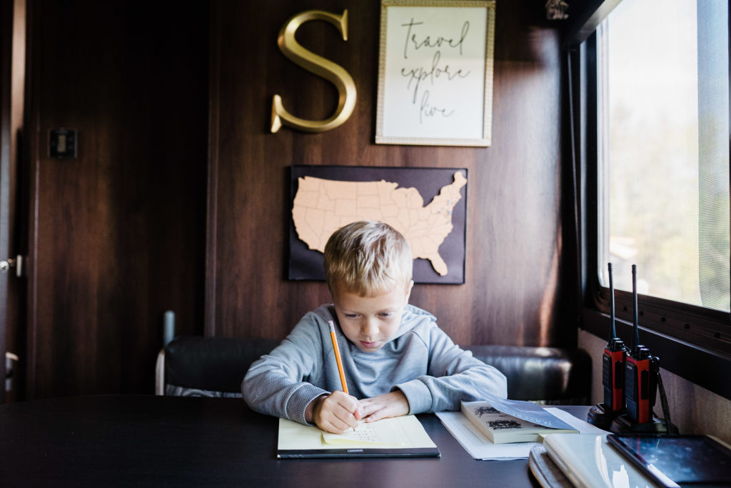 Traveling in an RV with kids. Home schooling at Jellystone Lazy River RV Resort Gardiner NY during the COVID 19 Pandemic. by Renee Ash Photography 