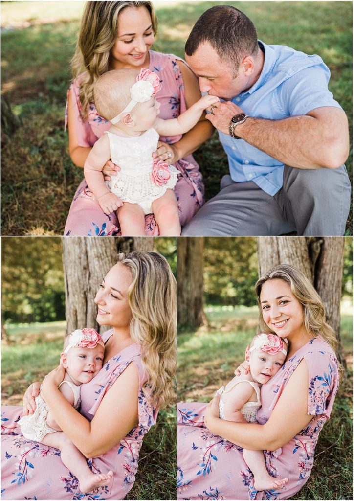 Mother daughter First birthday girl photos. One year old snuggling with mom wearing a pink floral maxi dress during a first birthday session in warwick new york with renee ash photography