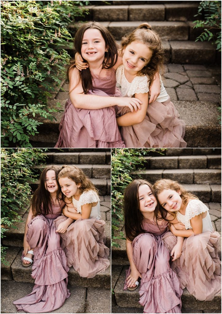 Little girl sisters portrait dressed in a bailey's blossoms lace bodysuit and a Joyfolie girls dress. Grand Cascades at Crystal springs resort, shot by Renee Ash Photography, Sussex County NJ family Photographer
