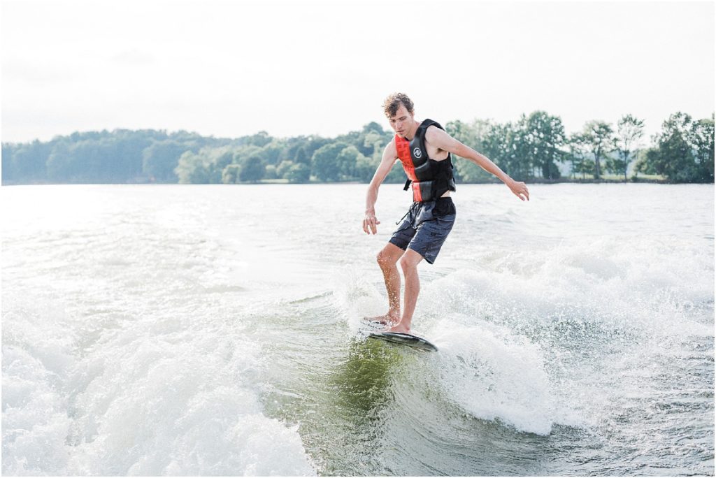 Smith mountain lake Virginia family photographer. SML Lake vacation by renee ash photography Wakesurfing behind the Cobalt R5Surf