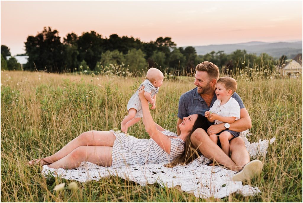 Summer Sunset Family session at Grand Cascades Lodge, Crystal Springs Resort, Vernon NJ. Family of four, grey and blue photo wardrobe, 4 month old boy and 3 year old boy. Photos by Renee Ash photography, New Jersey 
