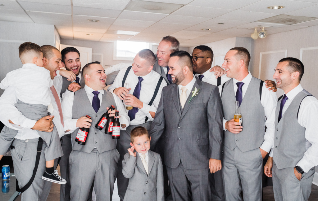 5 tips to find your wedding photographer. Things to consider when booking a wedding photographer. Renee Ash Photography Sussex County New Jersey wedding photographer. Groom and Groomsmen fun and candid getting ready photos. 
