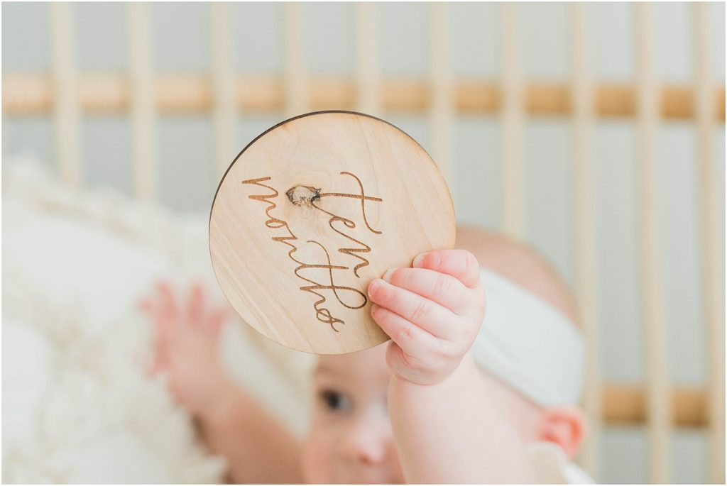 10 month old wooden baby age disks by lace and belle. Renee Ash photography vernon nj baby photographers