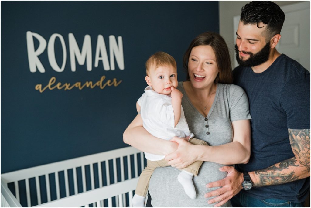 Family of three at home  in the nursery with a toddler boy. Maternity photos at home.  lifestyle First birthday pictures at home. by Renee Ash New Jersey photographers