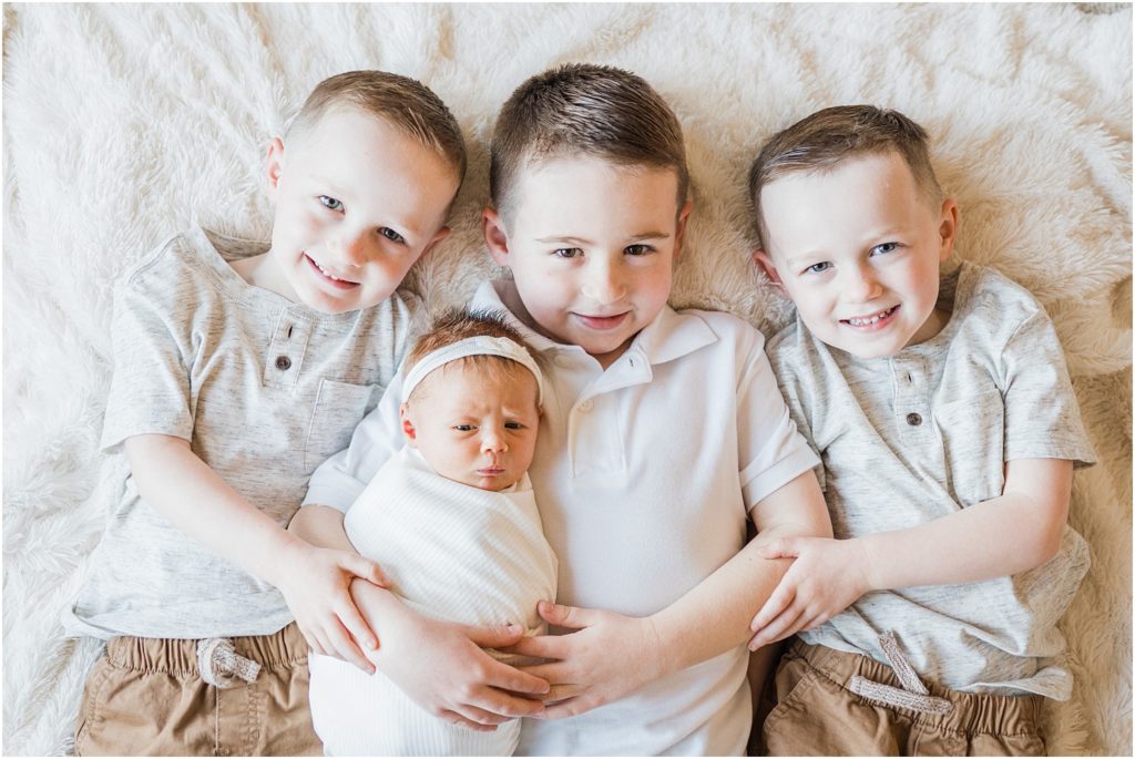 big brothers with their newborn baby sister pictures
Newborn pictures at home by Renee Ash Photography 