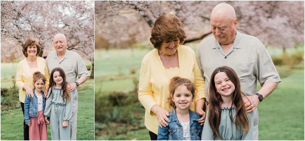 grandparent and granddaughters pictures in the Spring cherry blossoms in New Jersey. by Renee Ash Photography