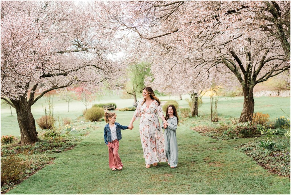 Spring mom and me pictures in the Spring cherry blossoms in New Jersey. Baltic born dress and bailey's blossoms outfits. by Renee Ash Photography