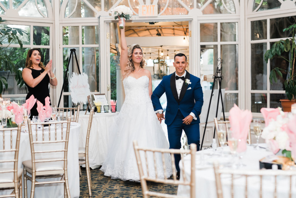 bride and grooms entrance into their reception in the Grand Conservatory at the Brownstone.  Renee Ash Photography