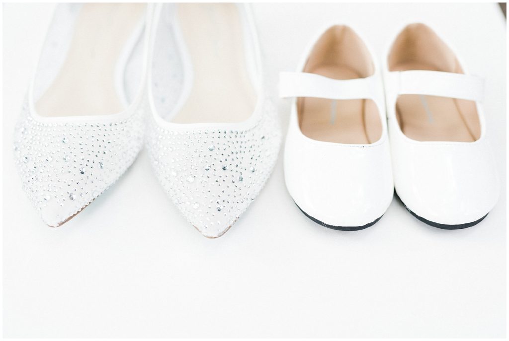 Bride's Betsy Johnson bridal flat shoes and with her flower girl and daughters shoes at the Brownstone.  Renee Ash Photography