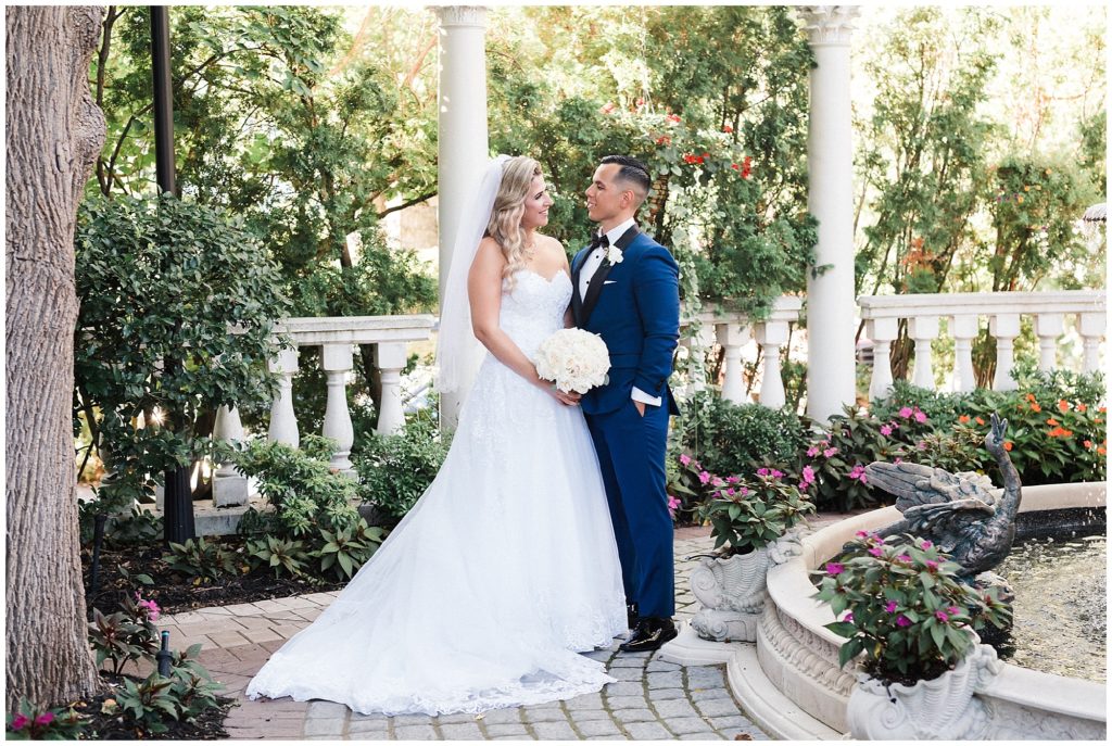 Bride and Groom portraits in the fountain courtyard of the Grand Conservatory at the Brownstone.  Renee Ash Photography