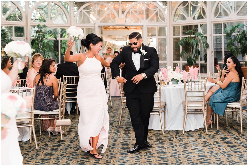 bridal party entrance into the reception in the Grand Conservatory at the Brownstone.  Renee Ash Photography