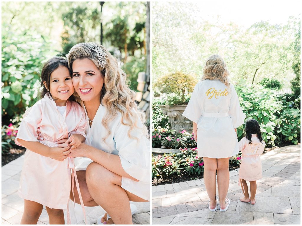 Bride with her flower girl and daughter in their matching bride and flower girl robes as she gets ready on her wedding day at the Brownstone.  Renee Ash Photography
