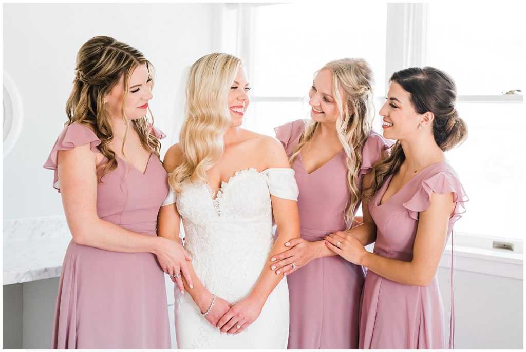 Bride getting ready with her bridesmaids at The Club at Picatinny.  New Jersey wedding venue. Renee Ash Photography