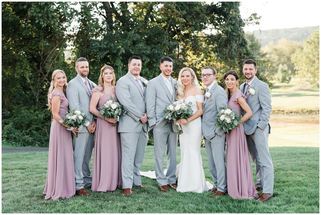 Bridal Party photos at The Club at Picatinny.  Pronovias wedding dress. Blush pink Bridesmaids dresses from Azazie. White rose and Eucalyptus bouquets. Renee Ash Photography