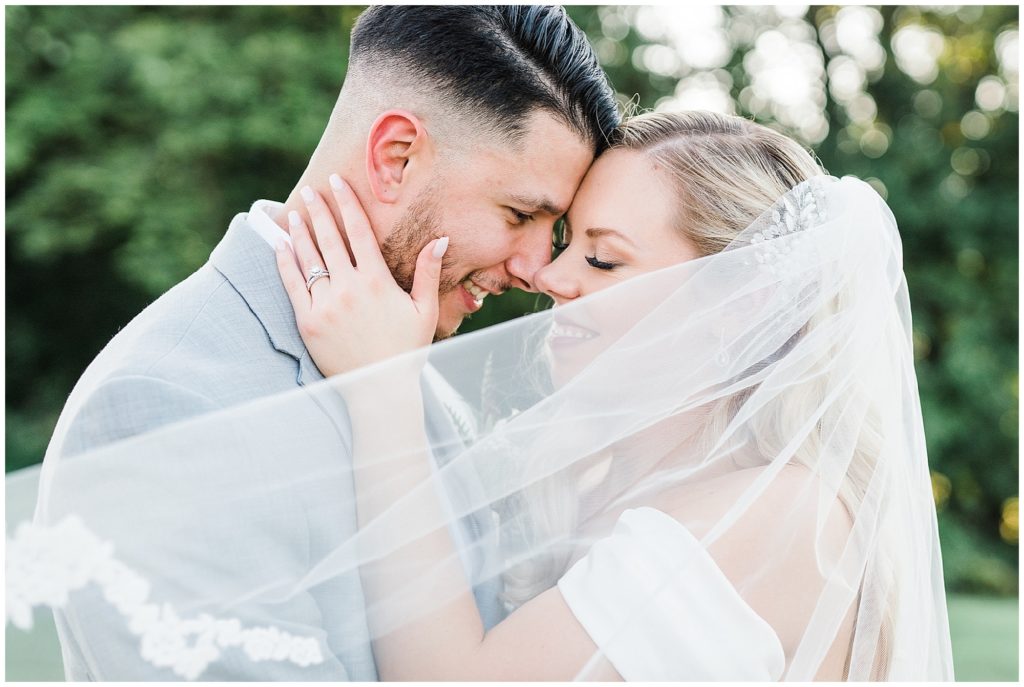 Bride and Groom portraits with bride's veil at The Club at Picatinny. Renee Ash Photography