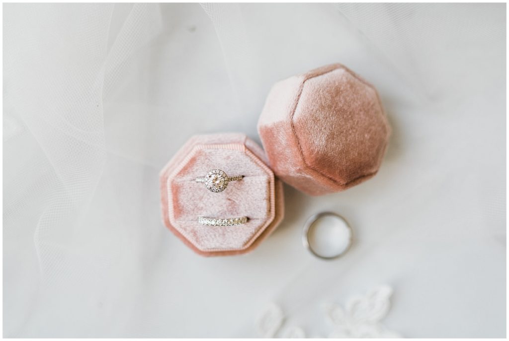 Wedding rings in a blush pink ring box at The Club at Picatinny.  New Jersey wedding venue. Renee Ash Photography