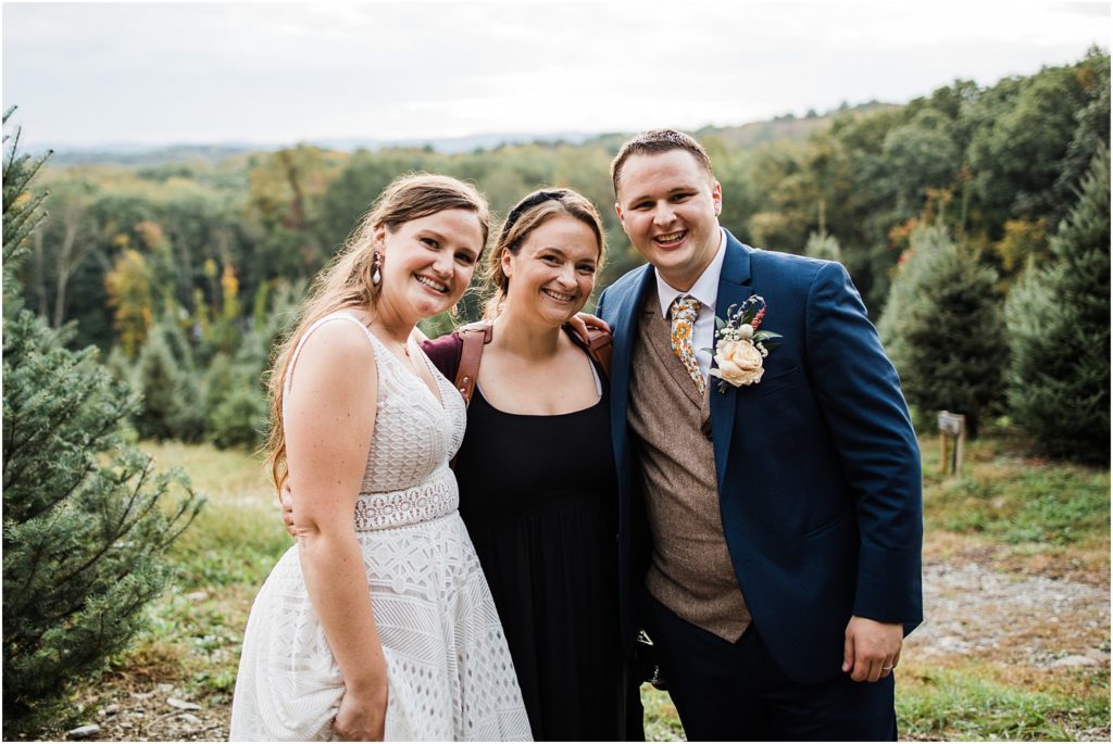 Ashley of Renee Ash Photography with the bride and groom at Emmerich Tree Farm Wedding warwick NY 