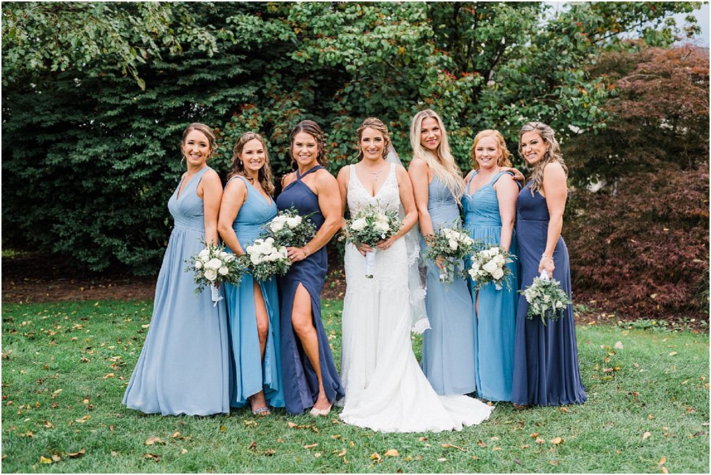 bridesmaids in mix matched blue gowns. Renee Ash Photography Sussex County NJ wedding photographer