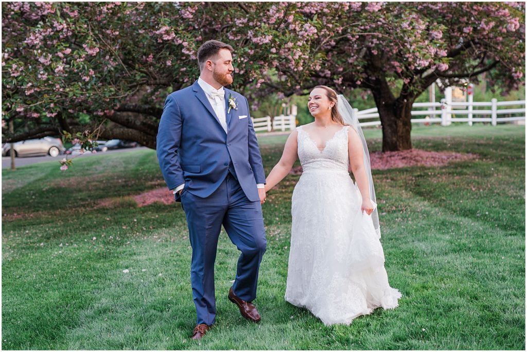 Spring blossom wedding photos. Bride and Groom portraits in the blossoms.  The Olde Mill Inn Wedding Venue in Northern NJ. Renee Ash Photography