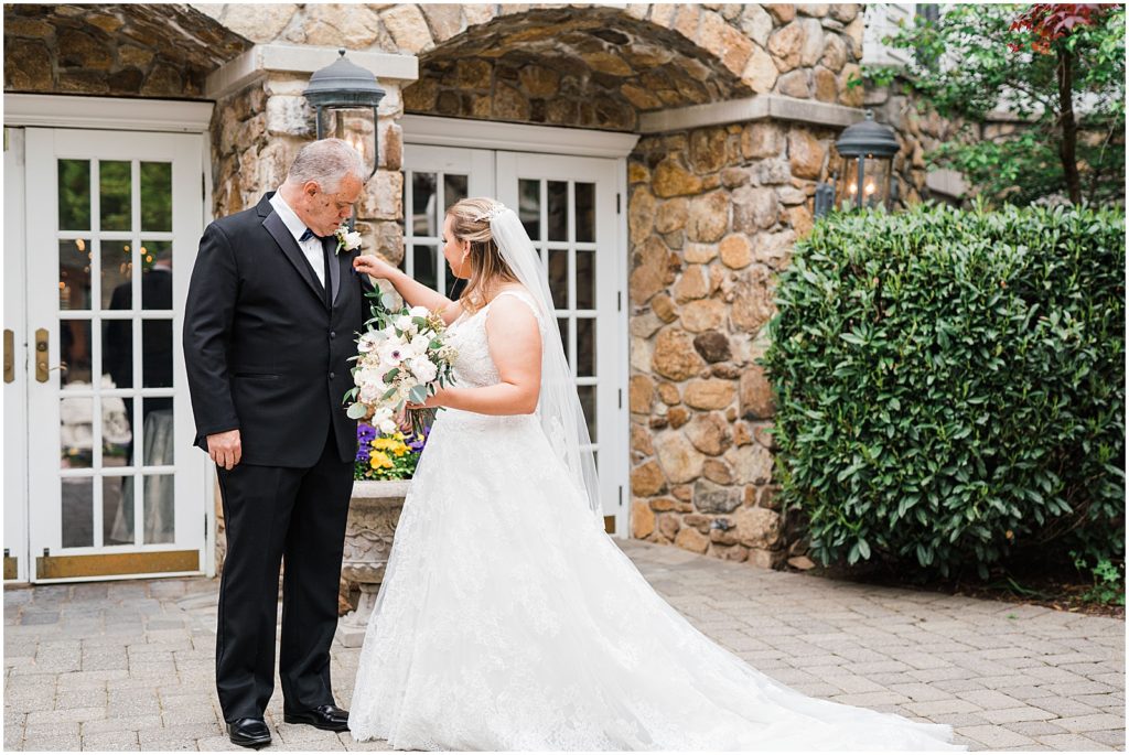 Father daughter first look photos in the courtyard at The Olde Mill Inn Wedding Venue in Northern NJ. by Renee Ash Photography 