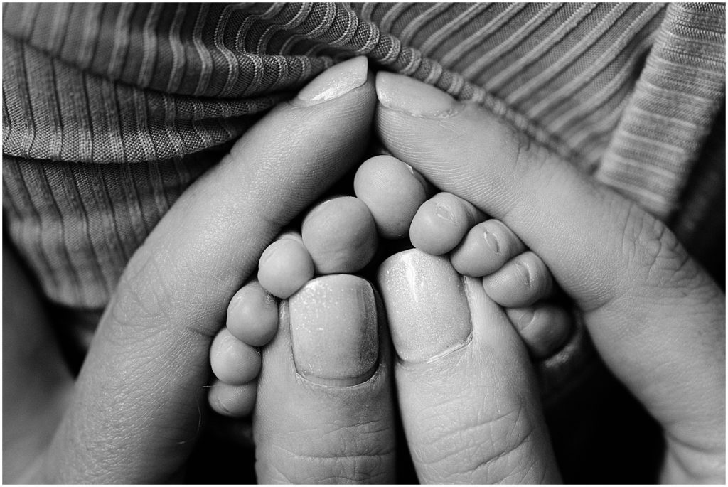 natural newborn Photos of baby toes in moms hands. baby boy. Renee Ash Photography. 