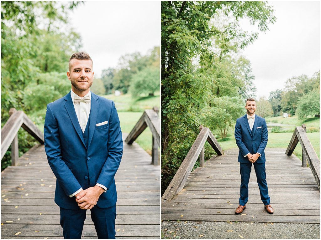First look Groom with Navy blue suit and beige bow tie.  Waterloo Village Wedding Venue  New Jersey Renee Ash Photography
