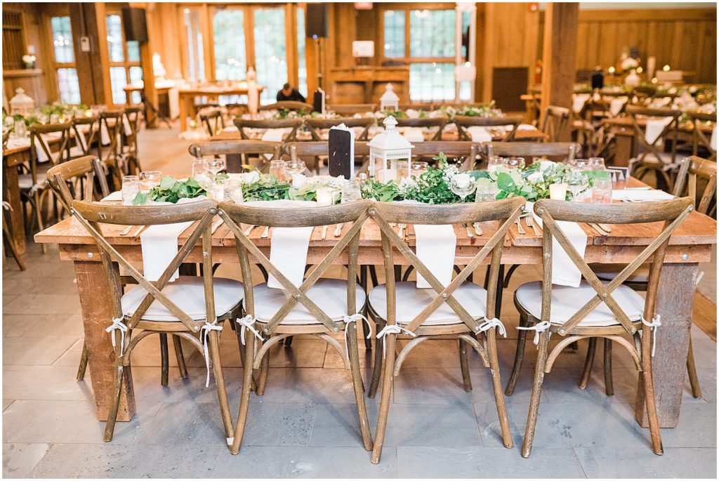 Waterloo Village Garden Wedding. Farmhouse style wooden cross back chairs. White florals and greenery. mini white lanterns on the reception table. Renee Ash Photography