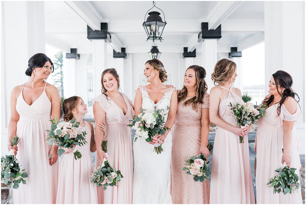 Bride and Bridesmaid portraits under the car port at the The Ryland Inn Whitehouse station NJ. Pink mix and match bridesmaid dresses.  Renee Ash Photography Wedding photographer
