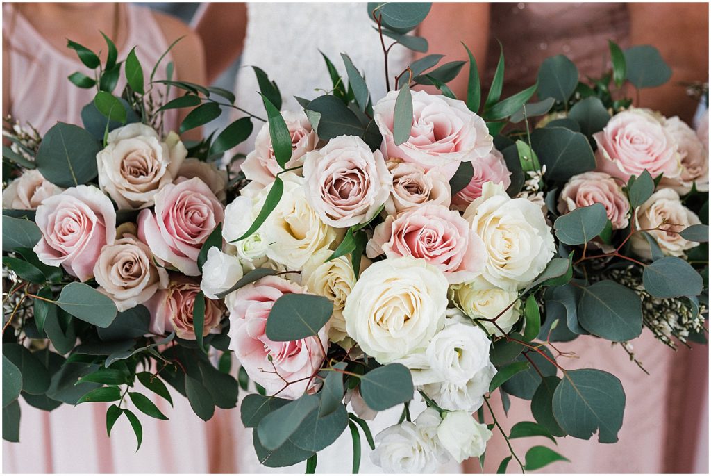 Blush and cream rose bouquets with eucalyptus by Warren Country Events. 