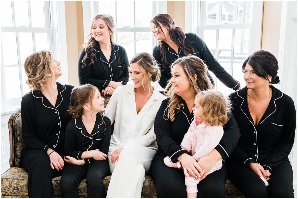 bridesmaids in their black and white pajamas. getting ready for the wedding day at the Coach House at the Ryland Inn Bridal cottage. 