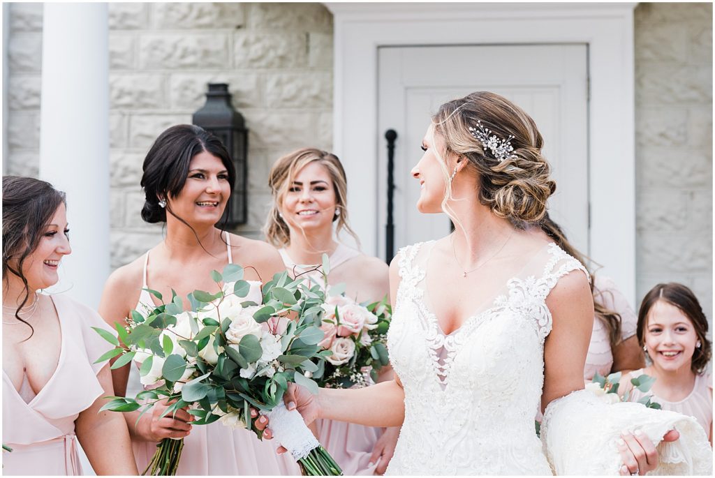 Bridal party portraits in front of the coach house and the Ryland Inn Winter wedding. by Renee Ash Photography