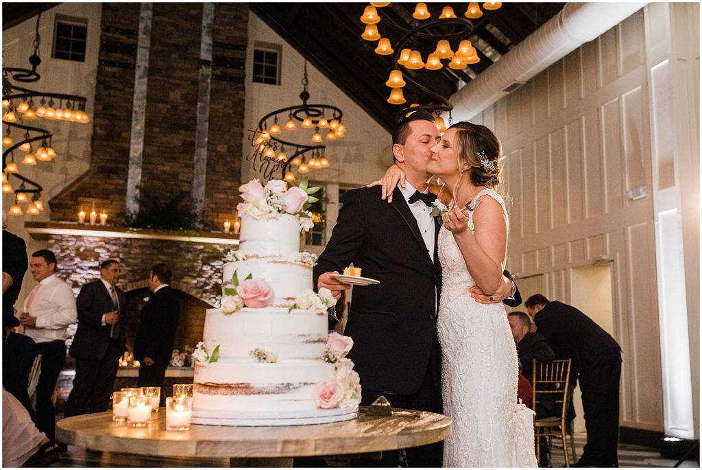 Cake cutting The coach house and the Ryland Inn Winter wedding. by Renee Ash Photography
