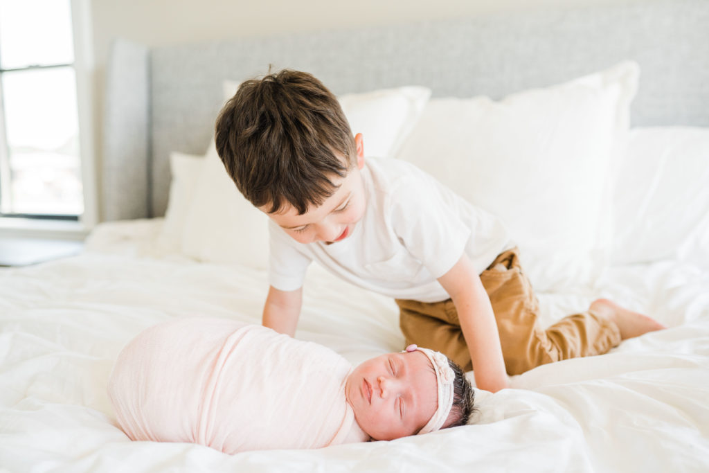 at home newborn photoshoot with an older sibling. New Jersey Newborn photographer. | Renee Ash Photography
