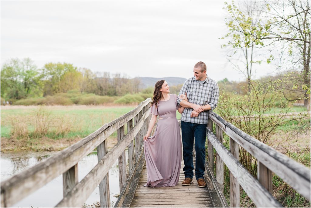 Sussex County wedding couple,  engagement photographer. dressy photo outfits for hiking in New Jersey. adventurous couples photo session. by Renee Ash Photography