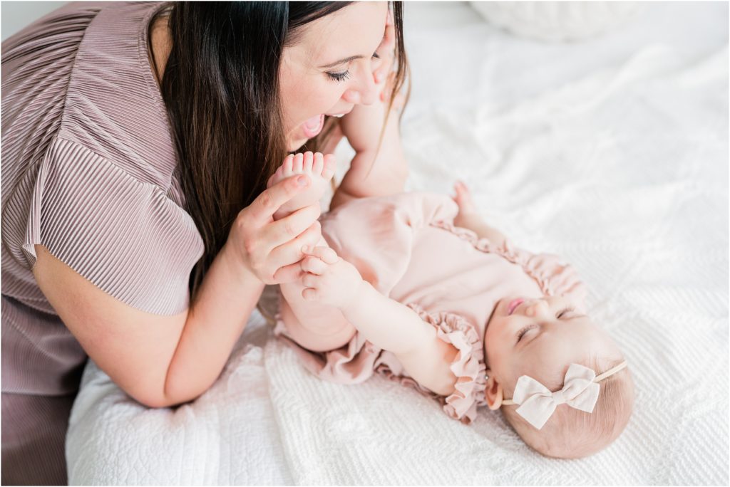 mother and baby pictures. Simple white natural baby milestone photographer in Sussex County New Jersey bailey's blossoms mauve romper. Baltic Born Mauve ribbed maxi dress. 