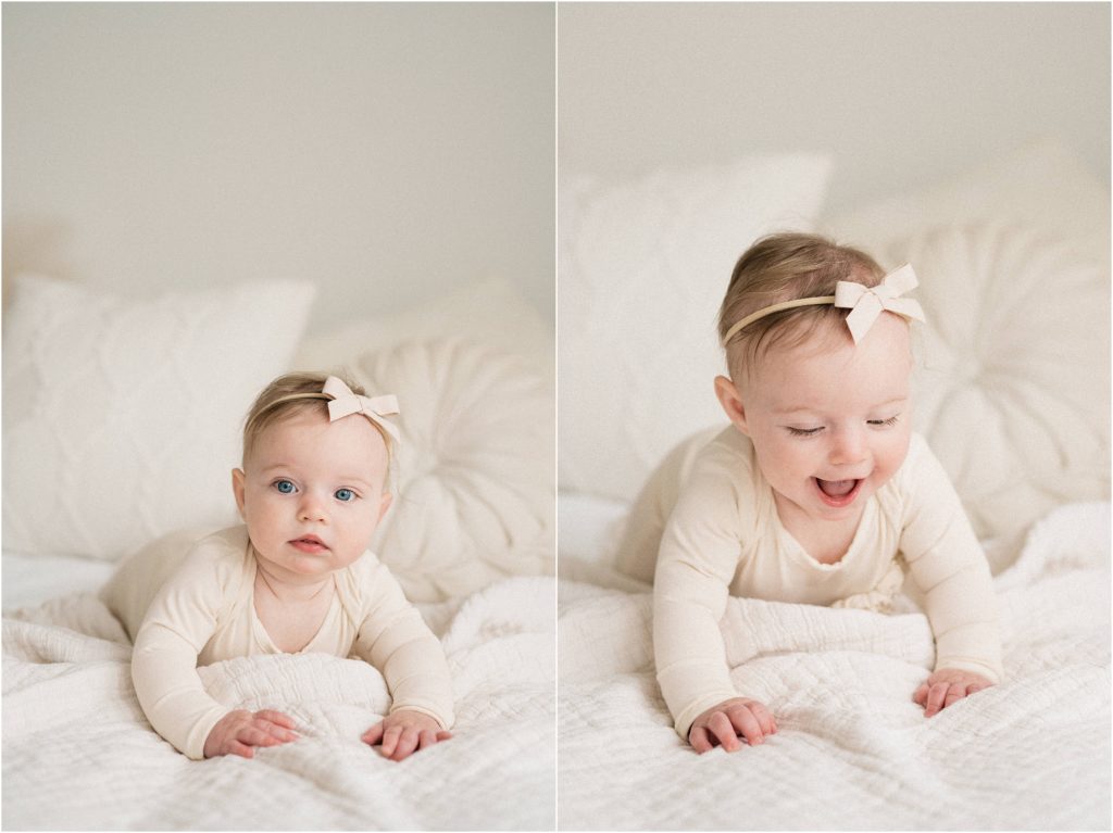 nine month old baby Wearing a neutral romper and ivory baby hair bow. Tummy time during a milestone photoshoot. Sussex County New Jersey photographer. 