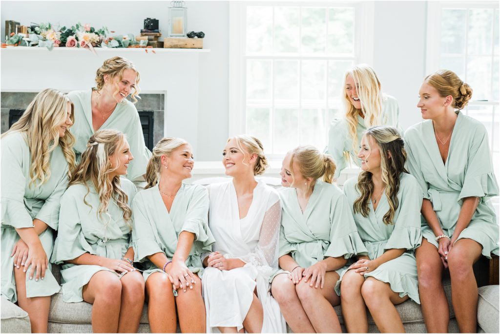 bridesmaids sage colored robes. getting ready together with the bride