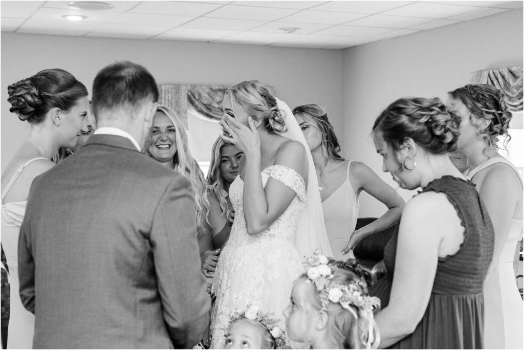 Pastor and the bridesmaids praying over the bride before she walks down the aisle. 
