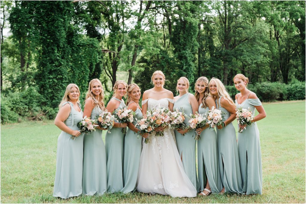 bridesmaids and bride wearing birdy grey gowns in sage.
