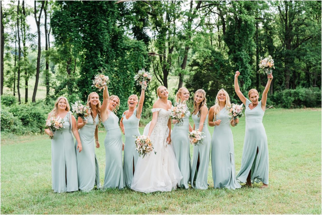 Bridal party dancing photo,  wearing birdy grey gowns in sage.