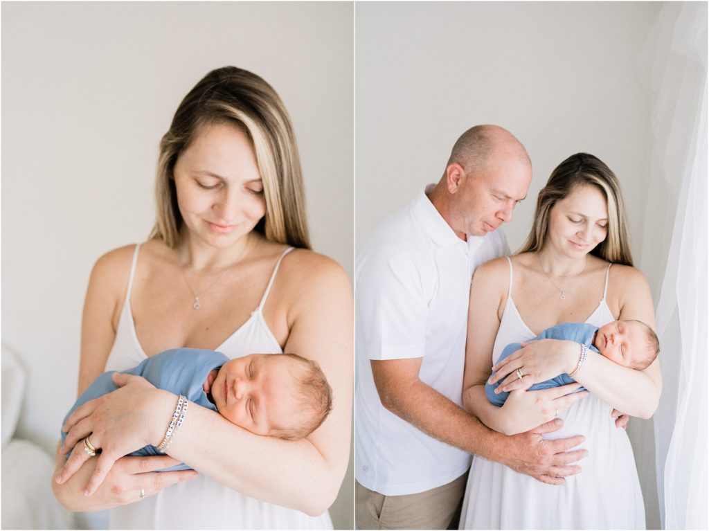 planning your newborn session Mom and dad holding a baby boy wrapped in blue in an all white studio. Renee Ash Photography, Sussex County NJ photo studio