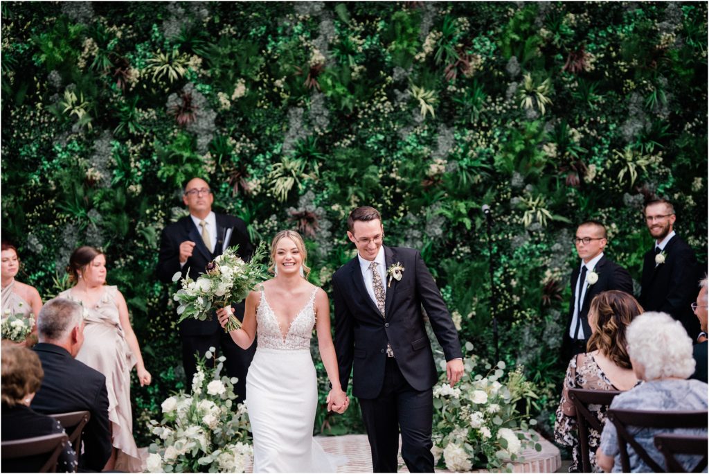 Perona Farms wedding venue. Greenery wall wedding decorations. New Jersey Wedding photographers