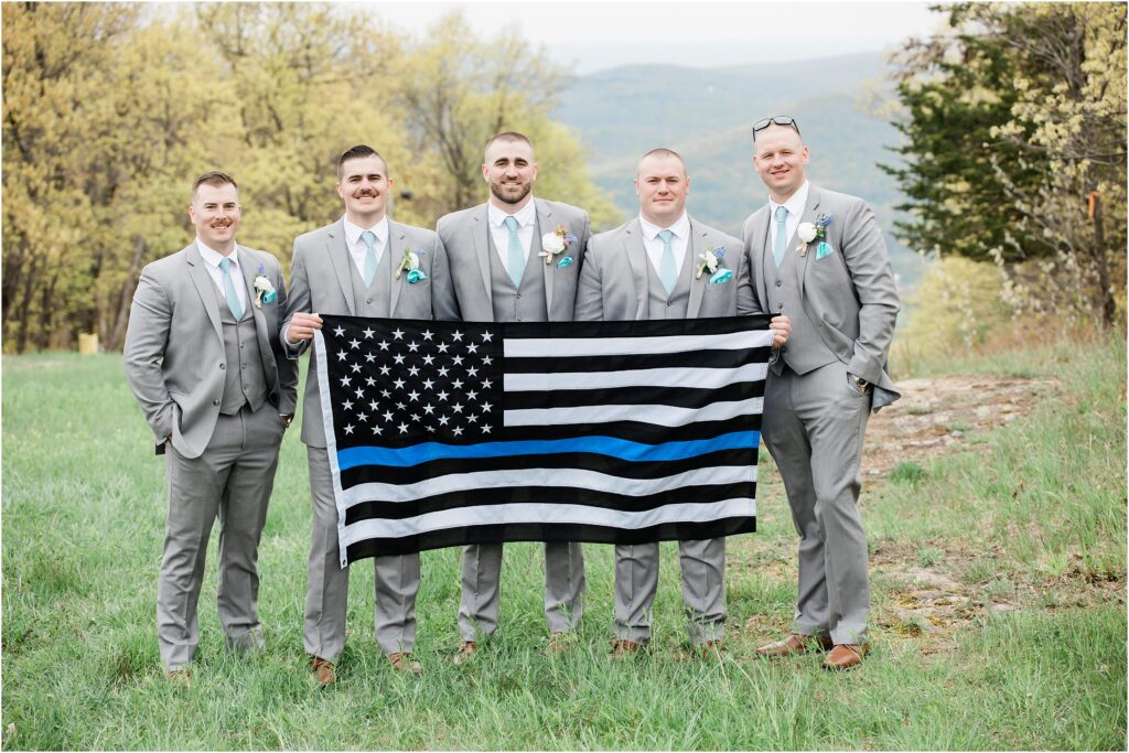 Thin blue line flag groomsmen photo. Police officer wedding. Mountain Creek's Red Tail lodge mountain top wedding. Renee Ash Photography. Sussex county nj wedding photographer