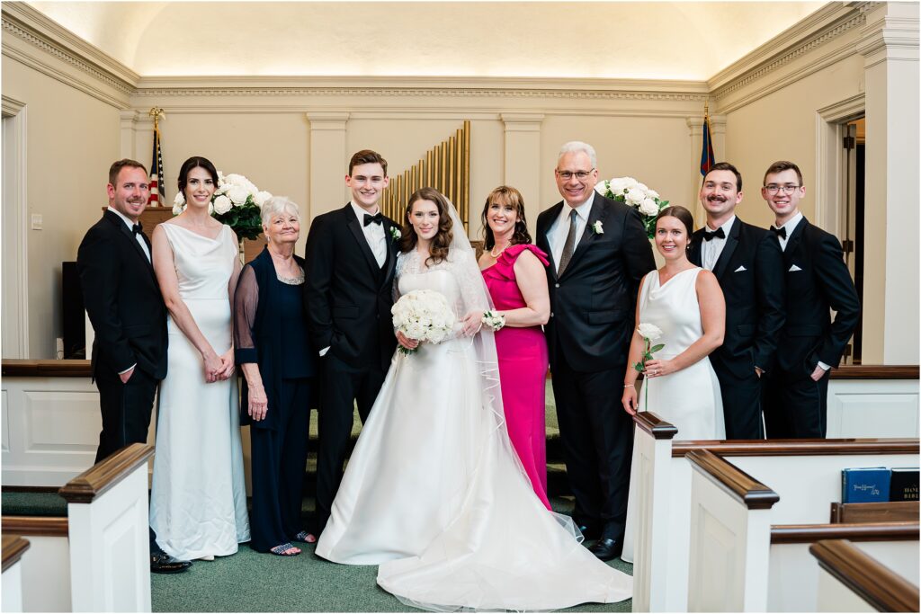 Classic family portraits at the altar after the traditional ceremony. Reformed baptist church of Lafayette wedding. Traditional black and white wedding by Renee ash photography