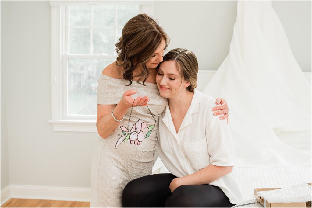 Mother of the bride gift. Bride giving her mother a gift on the morning of her wedding. Renee Ash Photography 
New Jersey Wedding photographer