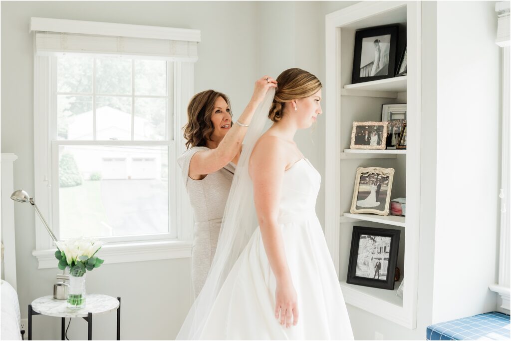 How to place a bridal veil. Mother of the bride putting in her veil. 
Bride getting ready in her childhood home  the morning of her wedding. 
Renee Ash Photography 
New Jersey Wedding photographer