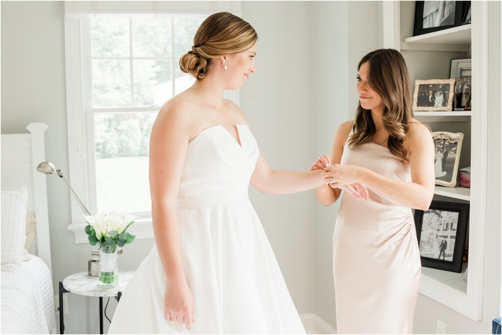 rita vinieris wedding gown Kleinfeld Bridal Store. 
Bride getting ready with her sister in their childhood home  the morning of her wedding. 
Renee Ash Photography 
New Jersey Wedding photographer