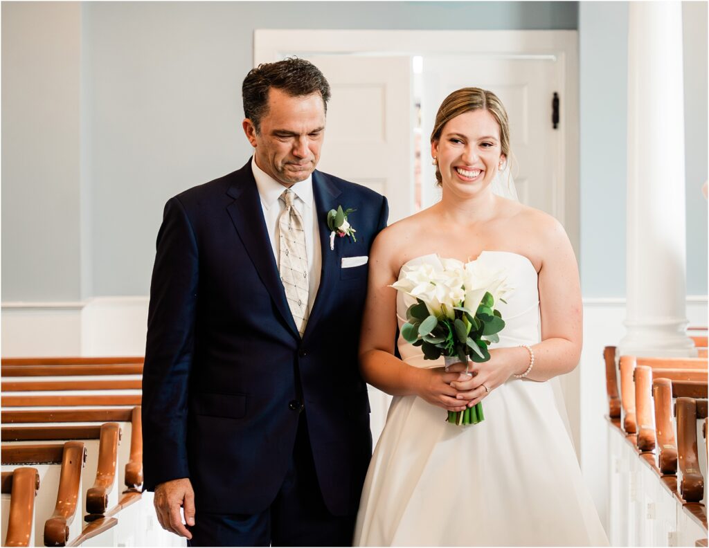 traditional First look down the aisle. Dad walking his daughter down the aisle. The botanical box wedding day bouquets. New Providence Presbyterian Church Wedding. New Jersey traditional little white wedding chapel. NJ wedding photographer. 