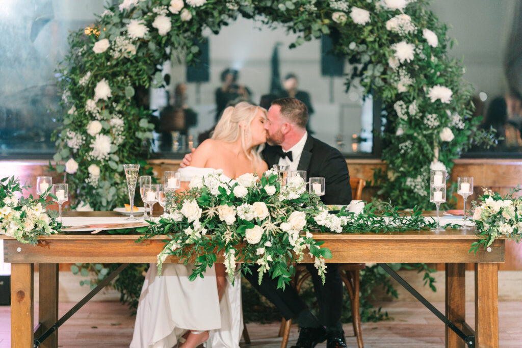 The Barn at Villa Venezia Farm View Room. Wedding Ceremony arch with white flowers and greenery. Renee Ash Photography