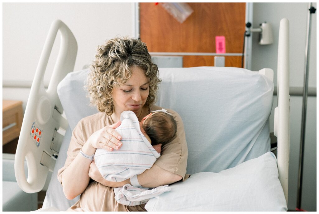 Mother holding her newborn during Fresh 48 hospital photo session in North New Jersey
Emotional first moments between mom and newborn in Morristown Medical Center hospital room
New mom cuddling her baby during Fresh 48 newborn photography session in NJ
Mother bonding with newborn baby within 48 hours of birth in hospital